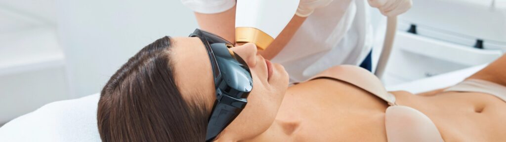 Cosmetologist performing an upper lip laser hair r